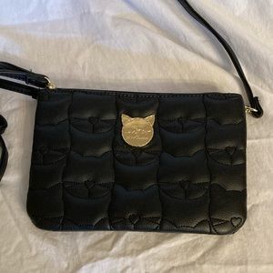 EUC if ever used.  Black wristlet or crossbody